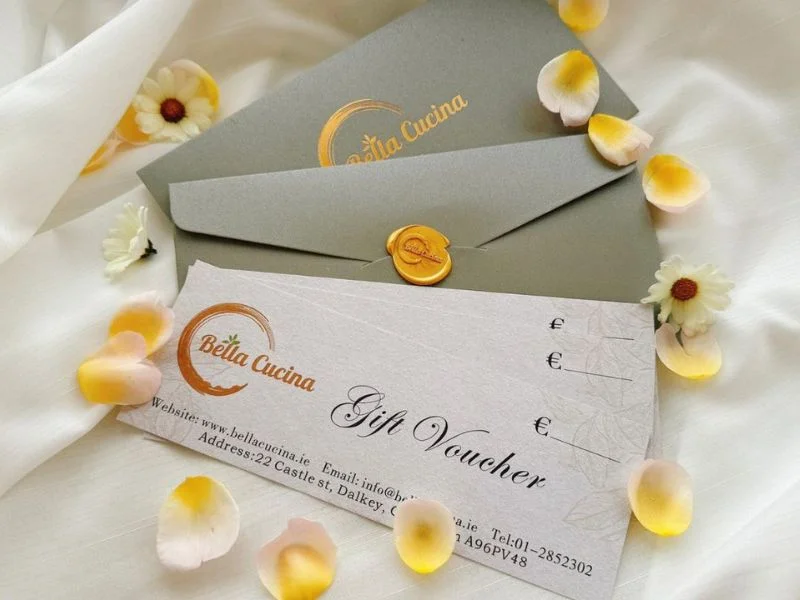 Bella Cucina gift voucher with envelope and decorative flowers