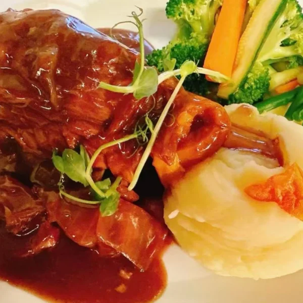 Italian main course served with mashed potato and vegetables