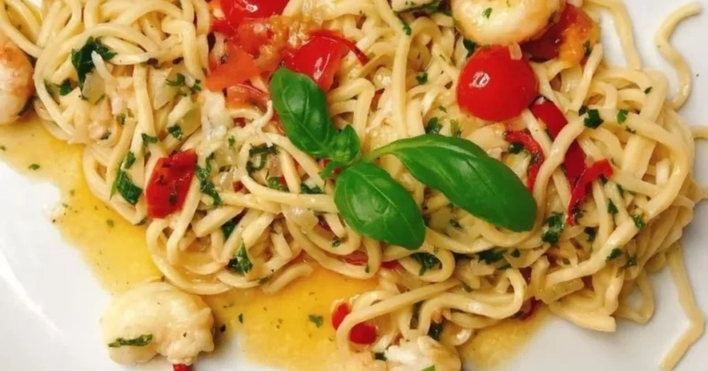 Fresh Italian pasta with cherry tomatoes and basil at Bella Cucina