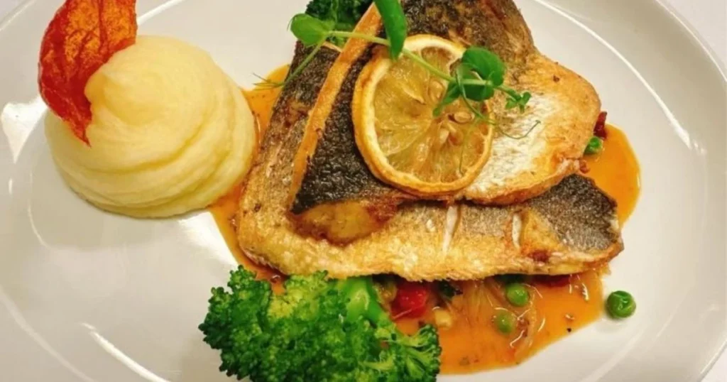 Pan-fried seabass served with mashed potato, broccoli and seasonal vegetables