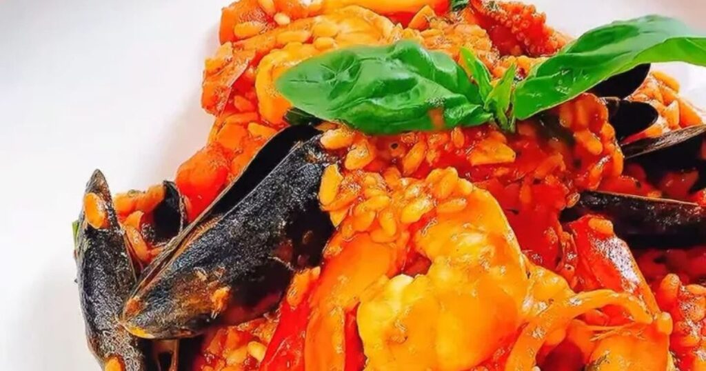 Seafood risotto with mussels, prawns and fresh basil at Bella Cucina