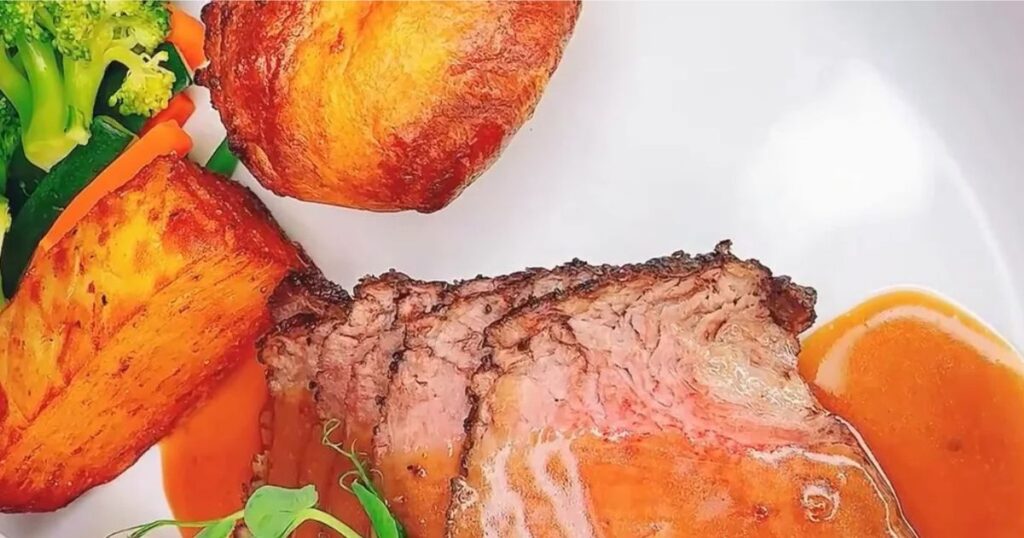 Roast beef with roast potatoes and red wine sauce at Bella Cucina