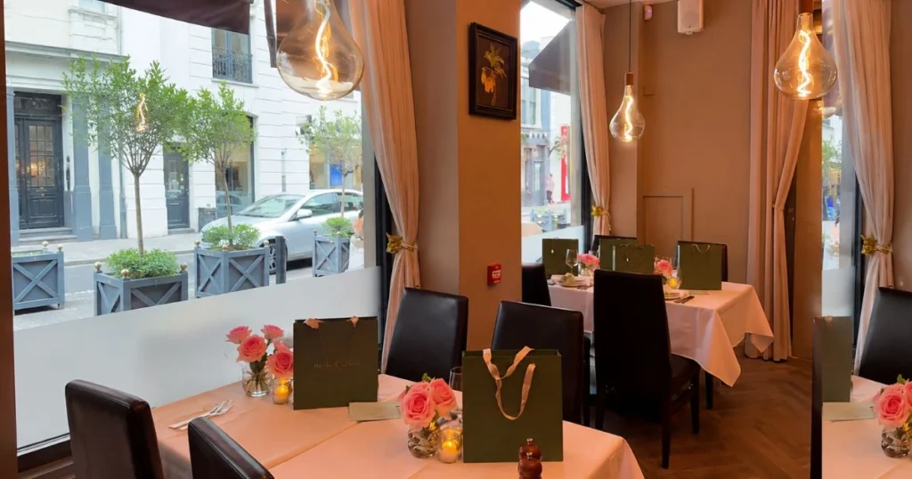 Elegant restaurant dining room with set tables and large windows
